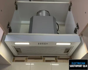 Close-up of an overhead ventilation unit installed on a ceiling.